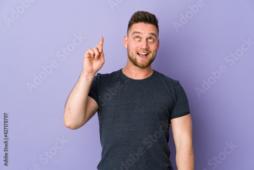 Russian handsome man over isolated background intending to realizes the solution while lifting a finger up