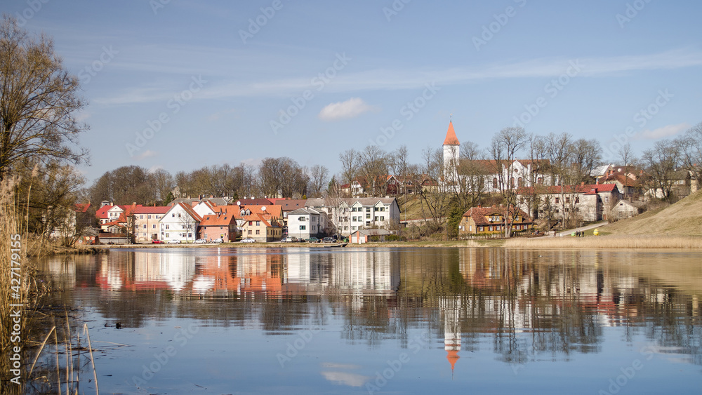 Beautiful old town houses with lake reflection, Talsi, Latvia.