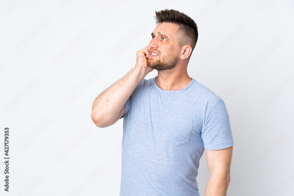 Russian handsome man over isolated background is a little bit nervous Russian handsome man over isolated background is a little bit nervous