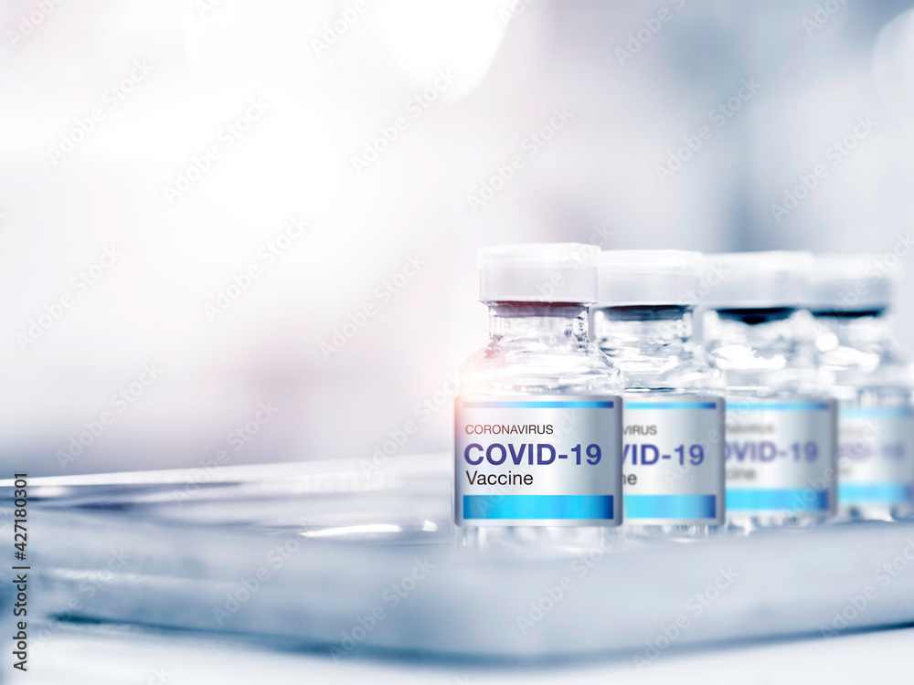 Covid-19 Coronavirus vaccine bottle with label. Covid-19 Coronavirus vaccine bottle with label.