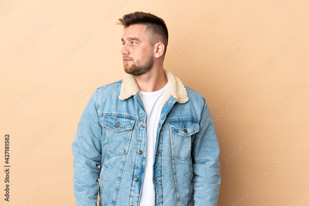 Russian handsome man over isolated background looking to the side Russian handsome man over isolated background looking to the side