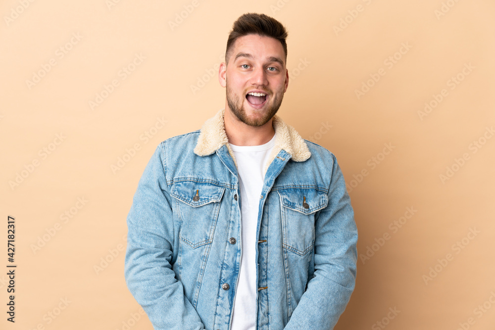 Russian handsome man over isolated background with surprise facial expression