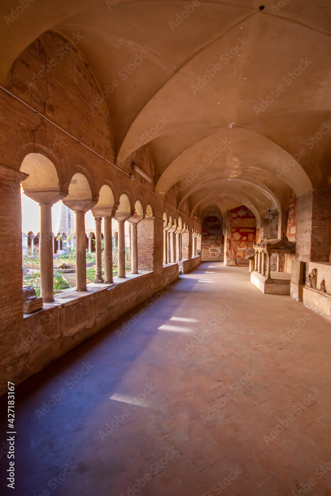The Cloister of The Basilica of San Lorenzo fuori le Mura.A square corridor built in the 12th century,Numerous sarcophagi and bas-reliefs are arranged along the walls