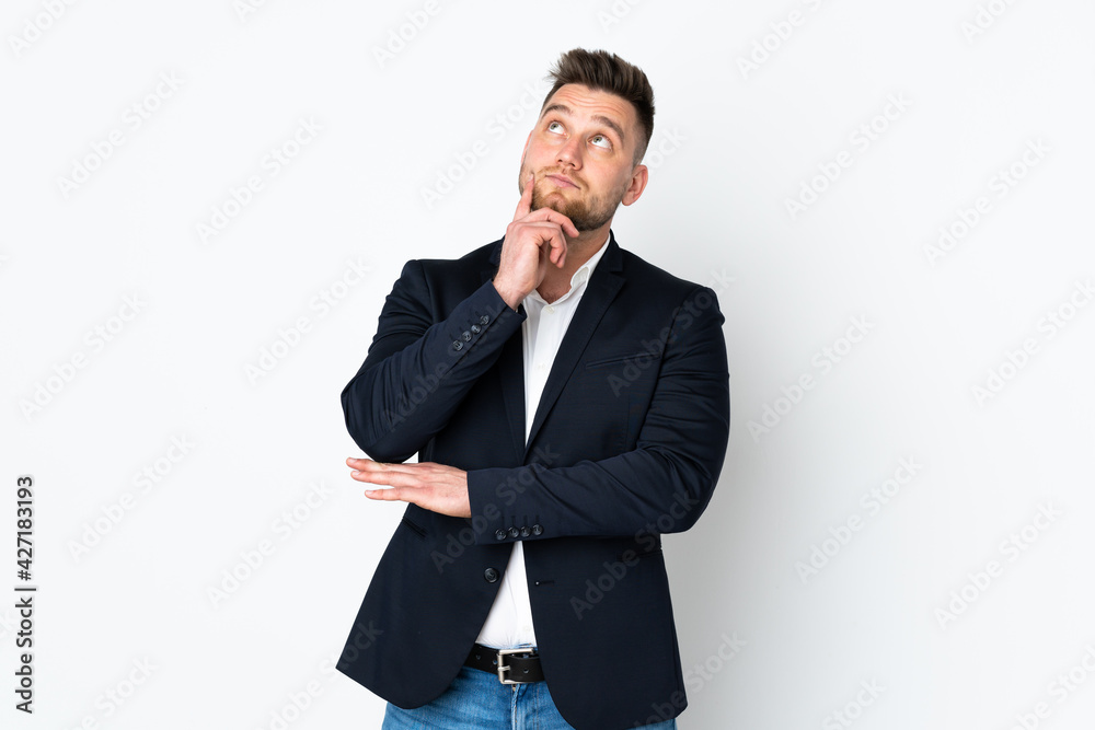 Young Russian business man isolated on white background thinking an idea Young Russian business man isolated on white background thinking an idea