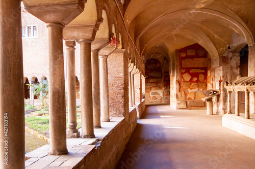 The Cloister of The Basilica of San Lorenzo fuori le Mura.A square corridor built in the 12th century Numerous sarcophagi and bas-reliefs are arranged along the walls