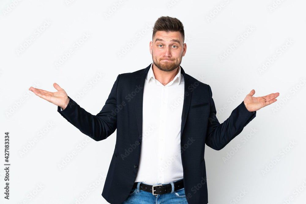 Young Russian business man isolated on white background having doubts with confuse face expression Young Russian business man isolated on white background having doubts with confuse face expression