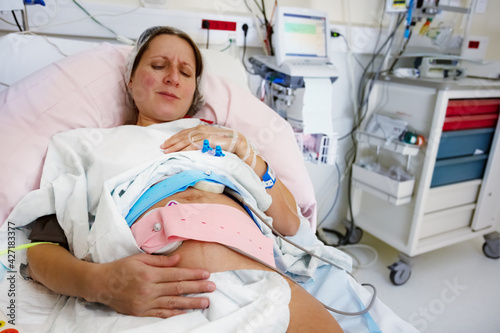 Pregnant woman with painful expression in labor