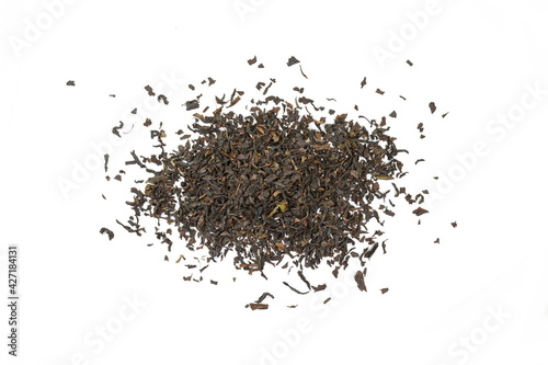 Dry black tea leaves isolated on white background.