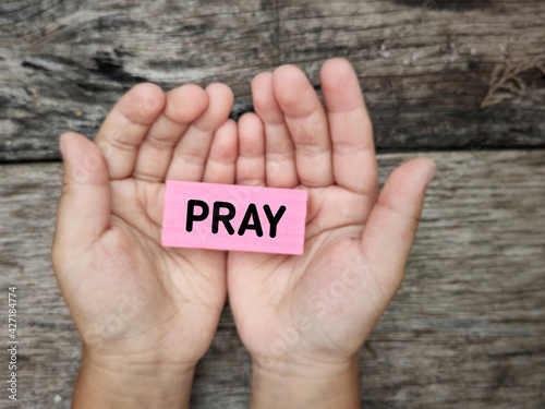 Inspiration and Motivational Concept - PRAY text background. Stock photo. photo