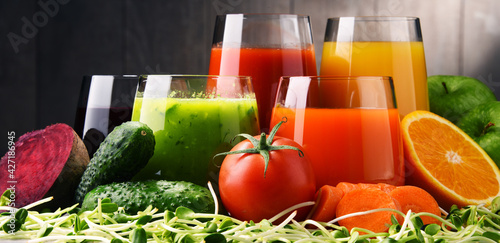 Glasses with fresh organic vegetable and fruit juices