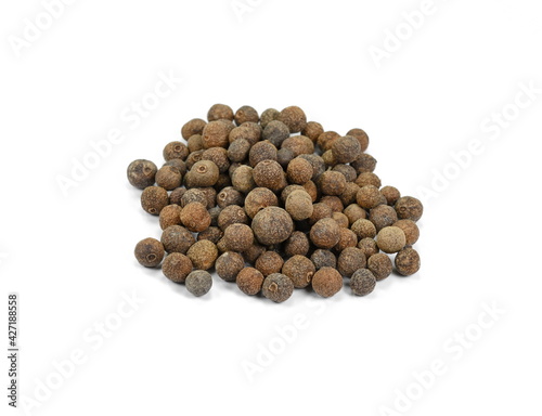 Allspice, pimento spice, Jamaican pepper pile isolated on white background