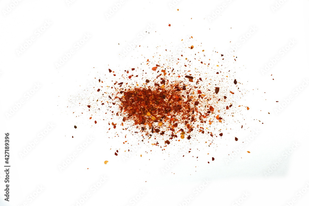 Red Hot Cayenne pepper isolated. Pile crushed red cayenne pepper, dried chili flakes and seeds isolated on white background Red Hot Cayenne pepper isolated. Pile crushed red cayenne pepper, dried chili flakes and seeds isolated on white background