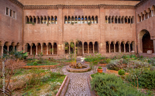 The Cloister of the Basilica of San Lorenzo,  with long corridor built in the 12th c.,has three and four light windows, that can be seen on the upper floor overlook the garden photo