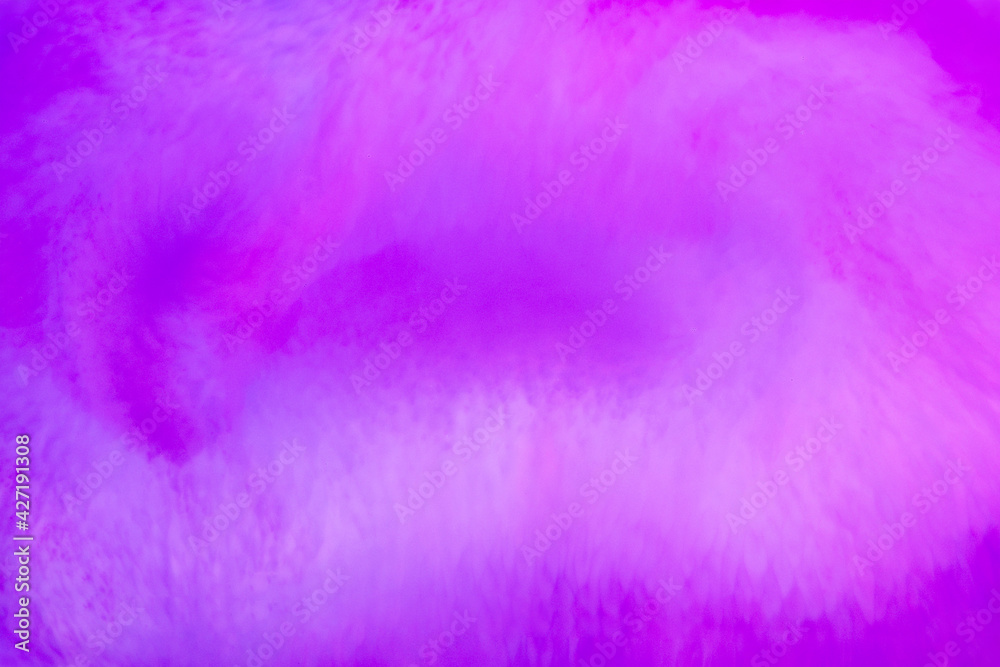 Purple through magenta blend of swirling ink or pigment
