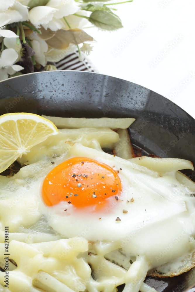 French fried and sunny side up fried up in frying pan French fried and sunny side up fried up in frying pan