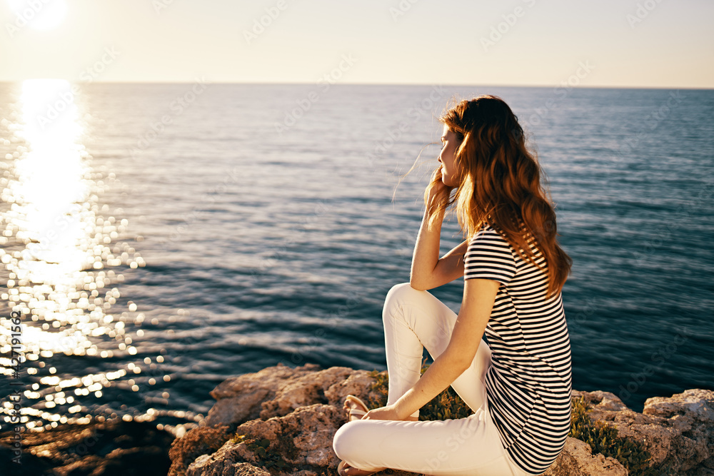 traveler on the sea in the mountains in the evening at sunset high cliffs mountains model traveler on the sea in the mountains in the evening at sunset high cliffs mountains model