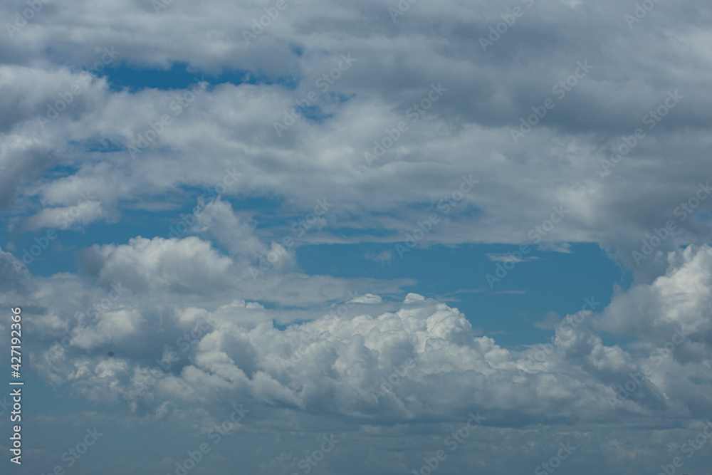 Fototapeta premium Clouds on a spring Sunday in the Mediterranean