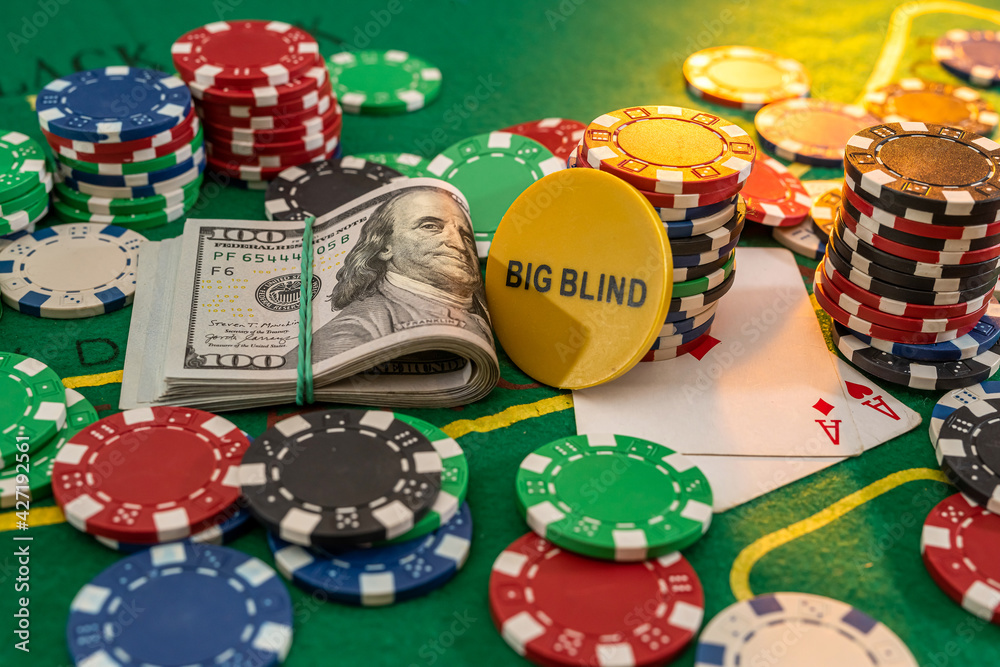 dollars and playing cards with chips in casino green table