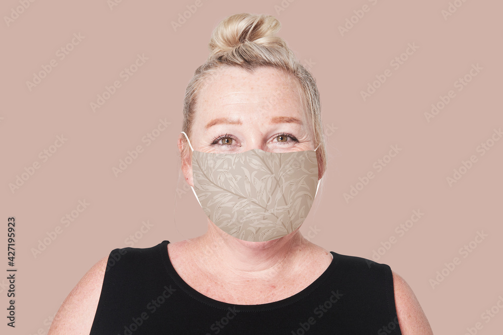 Mature woman wearing mask for Covid-19 prevention campaign