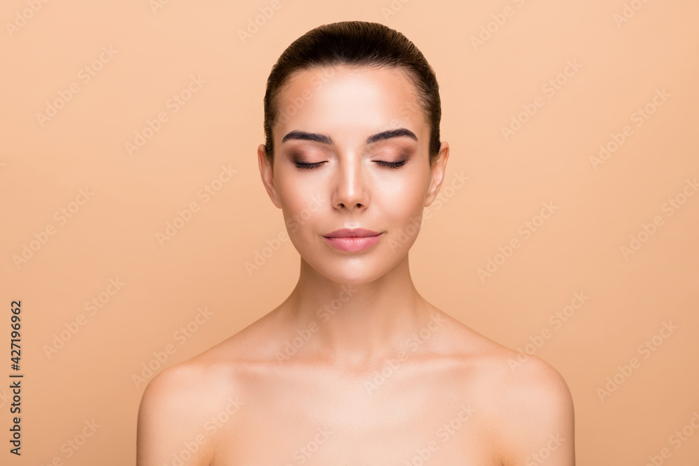 Photo of optimistic brunette hairdo lady closed eye without clothes isolated on pastel beige color background Photo of optimistic brunette hairdo lady closed eye without clothes isolated on pastel beige color background