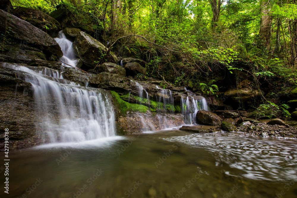 Spring waterfall in La Garrotxa, Girona, Spain Spring waterfall in La Garrotxa, Girona, Spain