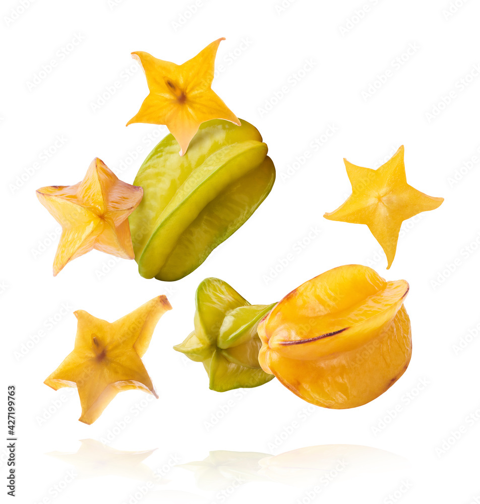 Fototapeta premium Creative image with fresh yellow carambola falling in the air