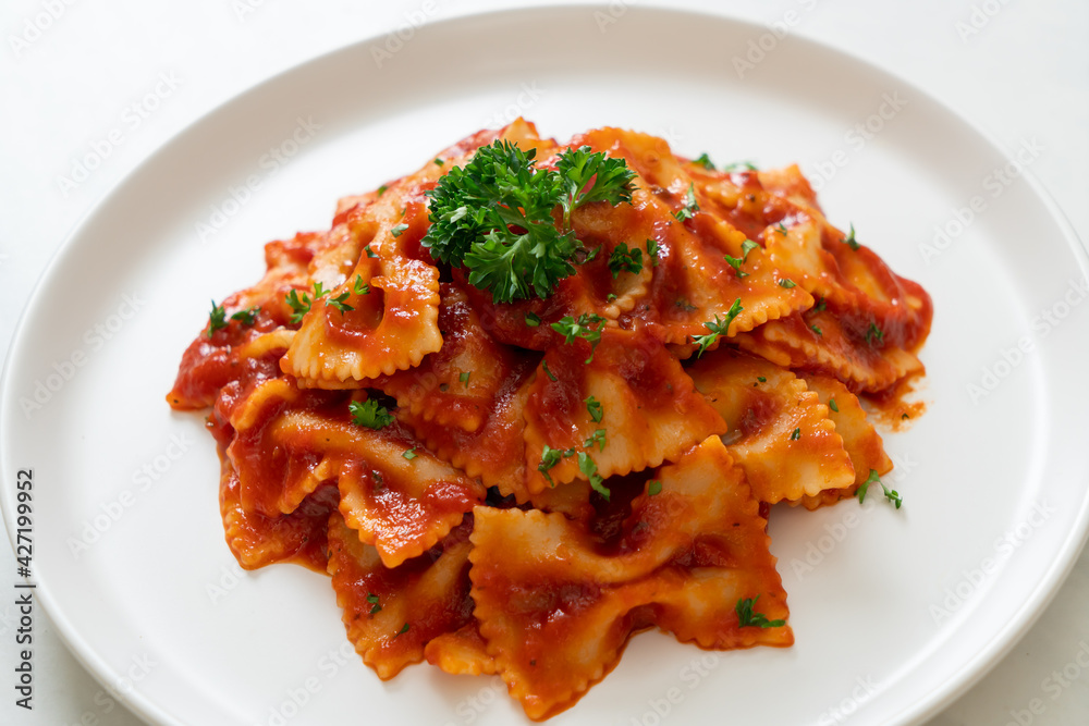 farfalle pasta in tomato sauce with parsley farfalle pasta in tomato sauce with parsley