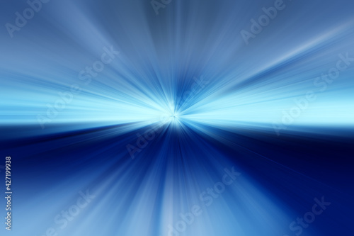 Abstract radial blur zoom surface in light blue, dark blue and gray tones. Abstract blue gray background with radial, radiating, converging lines. The background is divided into two parts.