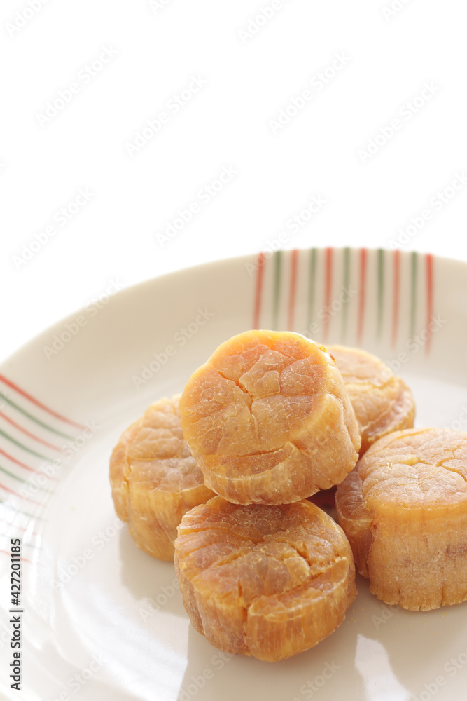 Chinese gourmet food ingredient, dried scallop on plate with copy space Chinese gourmet food ingredient, dried scallop on plate with copy space