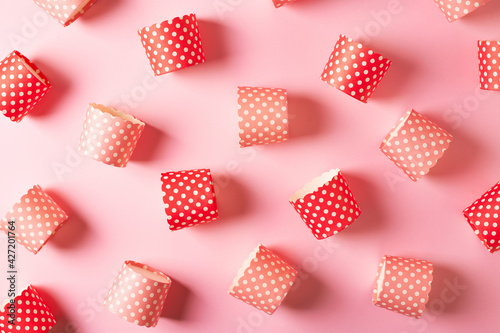 Cupcake paper form pattern on pink background