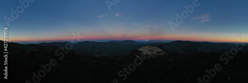 Schilderij op canvas 180 degree photo of the typical village of Gangi with a view of the Etna volcano during sunset