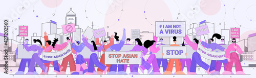stop asian hate people holding banners against racism support people during coronavirus pandemic concept