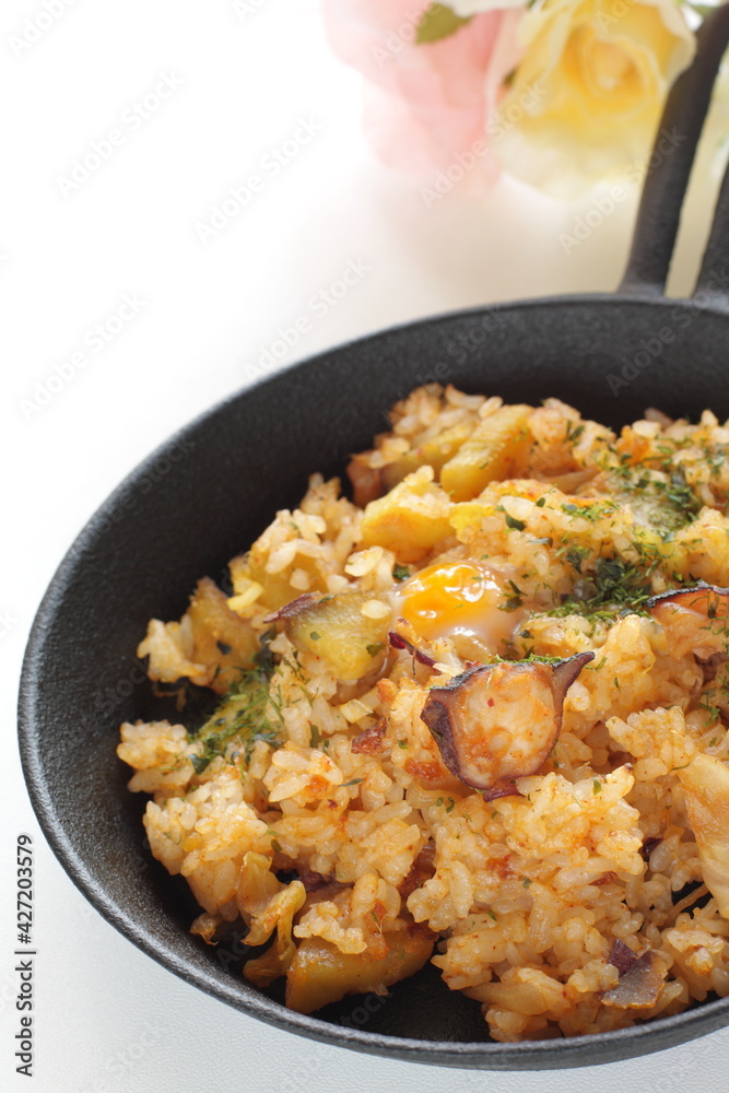 Korean food, spicy octopus fried rice in skillet pan Korean food, spicy octopus fried rice in skillet pan