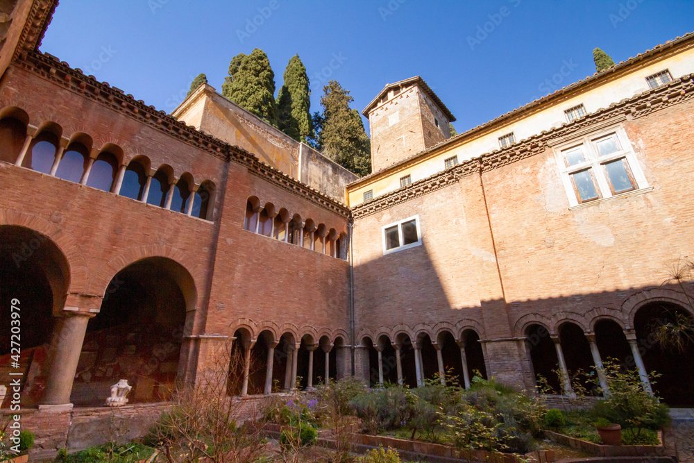 The European garden inside the cloister of the Basilica of San Lorenzo,with long corridor built in the 12th century,The environment is relaxing , peaceful and pleasant to live.