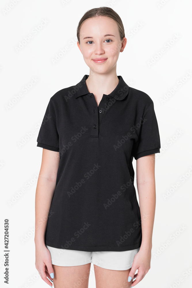 Teenage girl in black polo t-shirt for sporty youth fashion shoot Stock  Photo | Adobe Stock