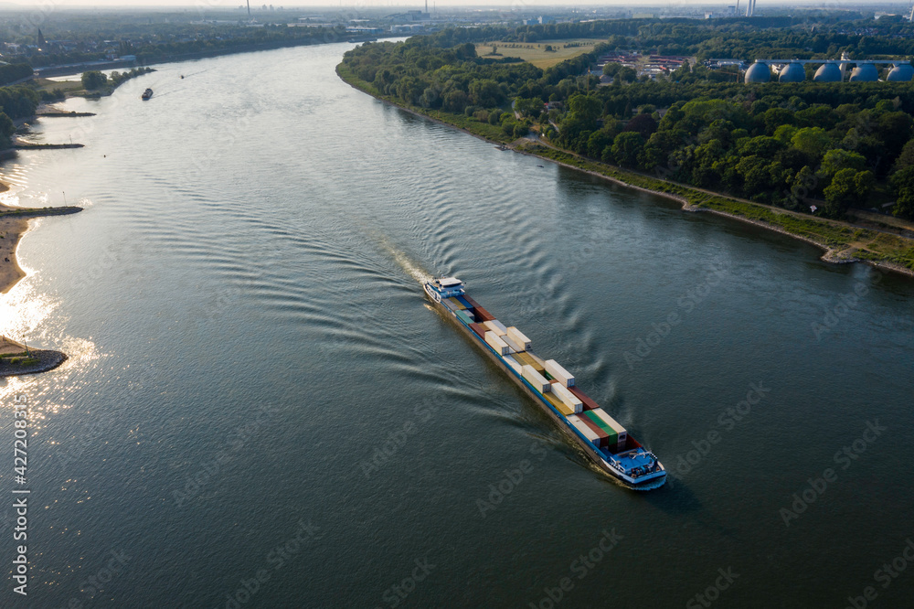 Container boat on the Rhine river of Cologne city