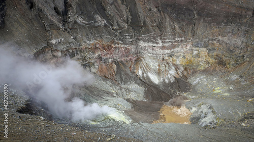 Colorful view inside Mount Lokon volcano smoking crater, near Tomohon, North Sulawesi, Indonesia photo