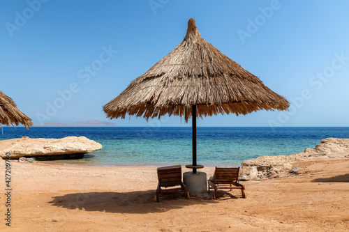 Parasol in Sunny beach in tropical resort in Red Sea coast in Egypt