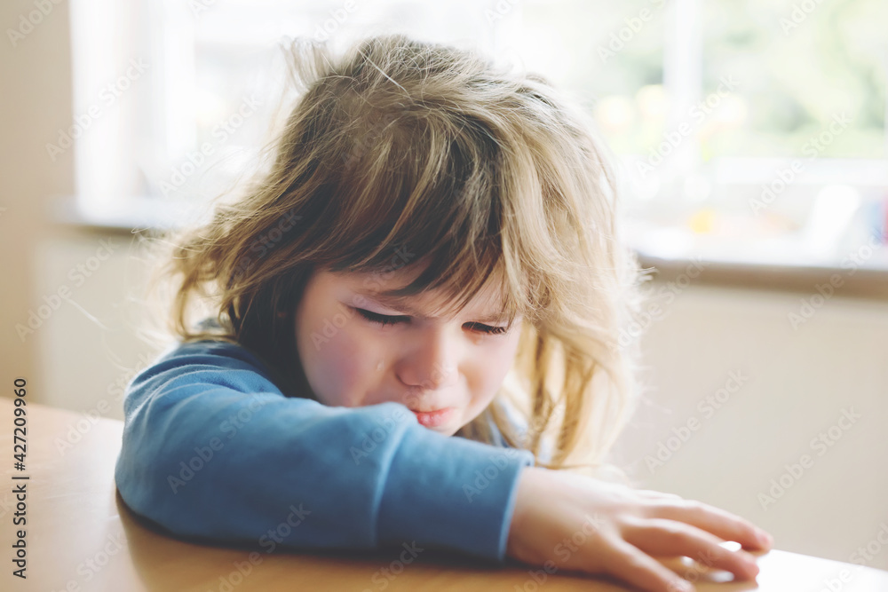 Cute upset unhappy toddler girl crying. Angry emotional child shouting. Portrait of kid with tears. Lonely child due to corona virus covid lockdown. Cute upset unhappy toddler girl crying. Angry emotional child shouting. Portrait of kid with tears. Lonely child due to corona virus covid lockdown.
