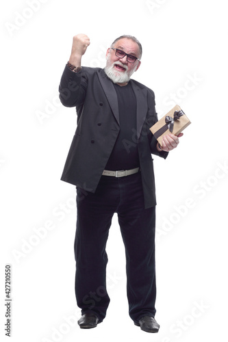 happy business man with a gift box. isolated on a white background. © ASDF