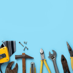 Top view design concept of Father's day with working tools on blue background.