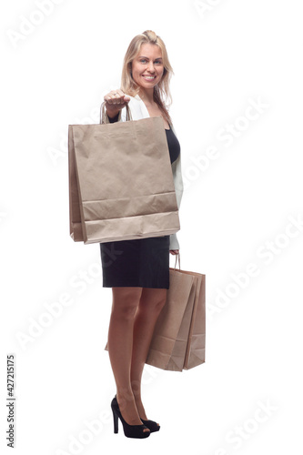 business woman with shopping bags looking at a white blank screen. © ASDF