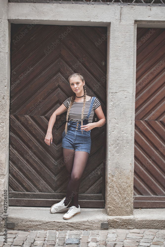 beautiful girl in front of a door beautiful girl in front of a door