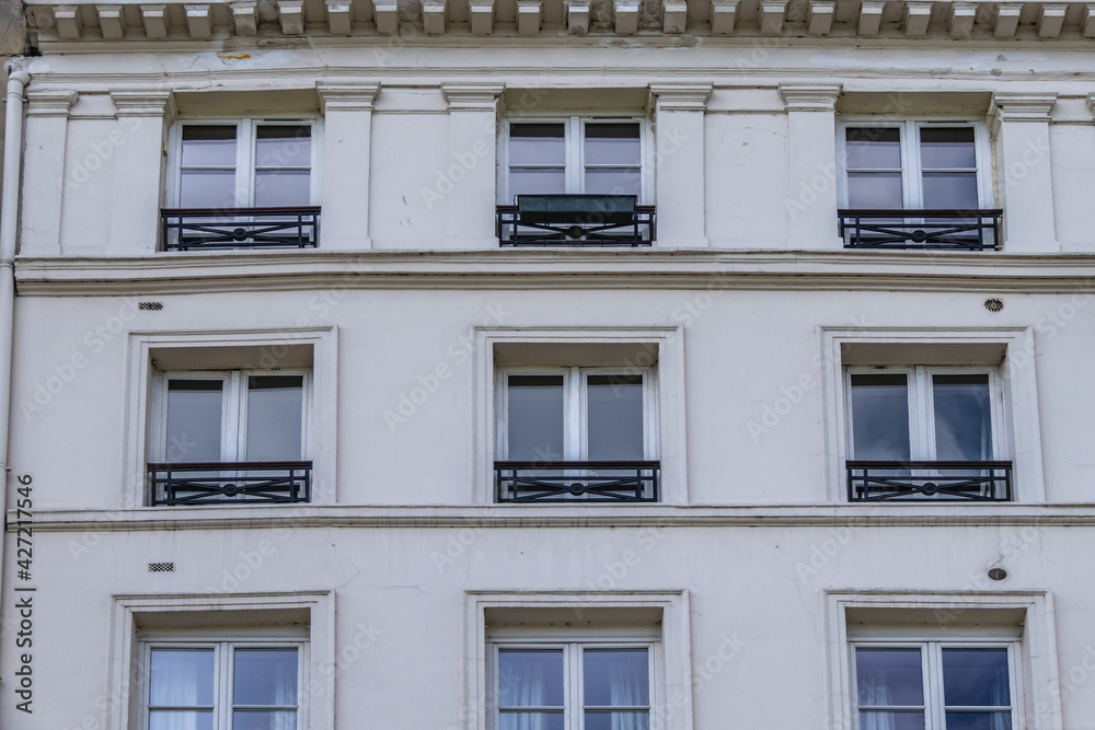 Old French house with traditional balconies and windows. Paris, France. Old French house with traditional balconies and windows. Paris, France.