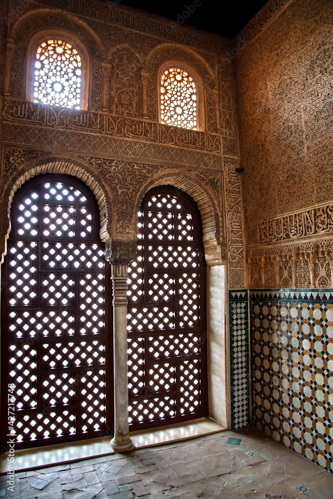 Carved wooden windows view Granada. Alhambra Palace in Granada. Nasrid Palace, islamic art.