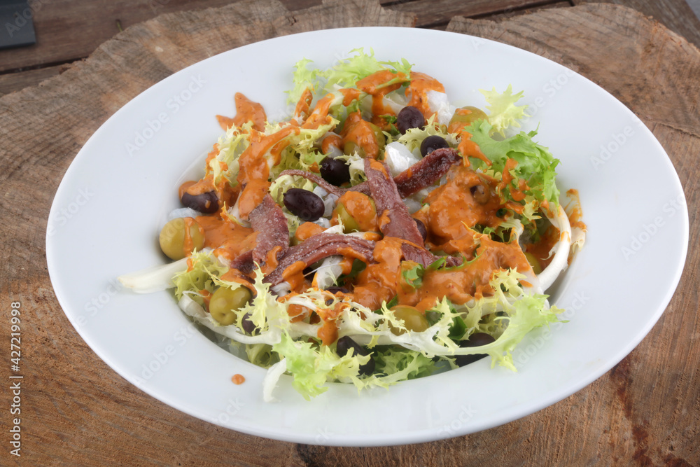 salad with cod anchovies and sauce tipycal from catalonia salad with cod anchovies and sauce tipycal from catalonia
