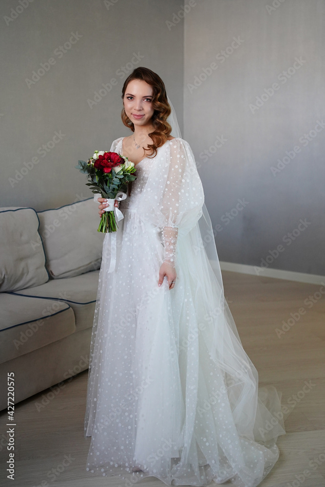 bride with long hair, with bouquet of flowers, in white wedding dress in room. bride with long hair, with bouquet of flowers, in white wedding dress in room.