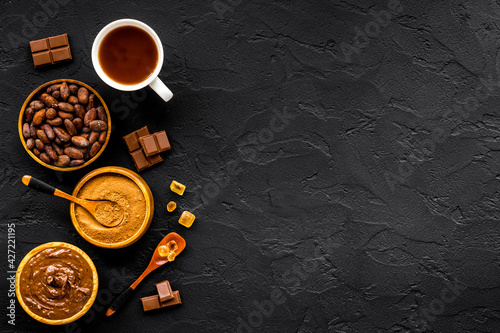 Background with assorted coffee and cocoa - beans with powder and hot drink