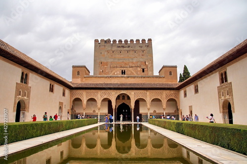 Tourists visit Alhambra Palace in Granada, Spain. Alhambra is more than 1000 years old and is a UNESCO World Heritage Site. photo