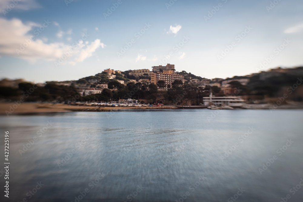 Some hotels and buildings on a sea coastline on a blue sunny sky in Costa Brava, Catalonia